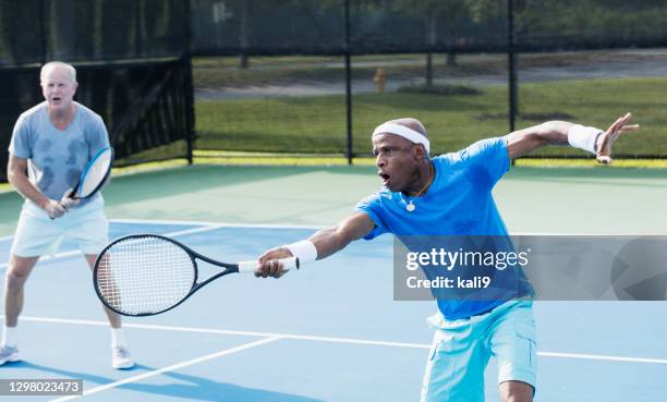 men playing tennis, doubles team - senior tennis stock pictures, royalty-free photos & images