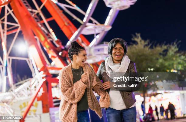 senior woman and adult granddaughter at county fair - county_fair stock pictures, royalty-free photos & images