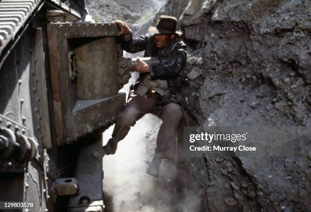 American actor Harrison Ford as the eponymous archaeologist in the tank chase scene from the film 'Indiana Jones and the Last Crusade', 1989.