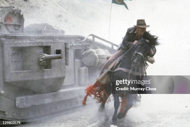 American actor Harrison Ford as the eponymous archaeologist in the tank chase scene from the film 'Indiana Jones and the Last Crusade', 1989.