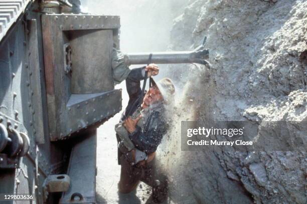 American actor Harrison Ford as the eponymous archaeologist in the tank chase scene from the film 'Indiana Jones and the Last Crusade', 1989.