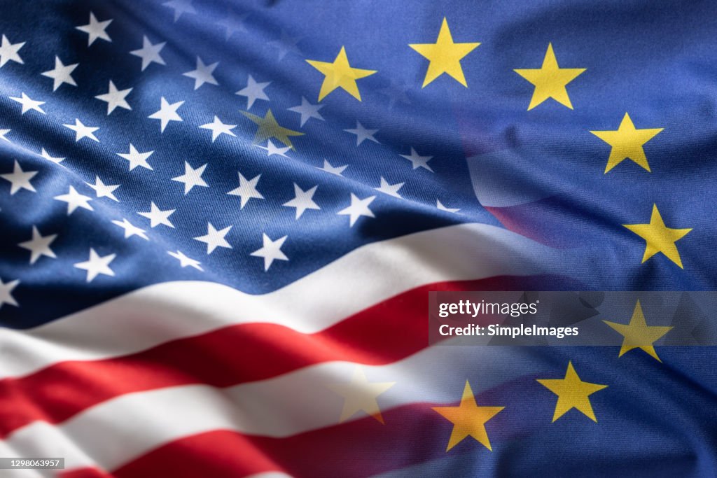 American and European Union flags together. Cooperation between the United States of America and the European Union.