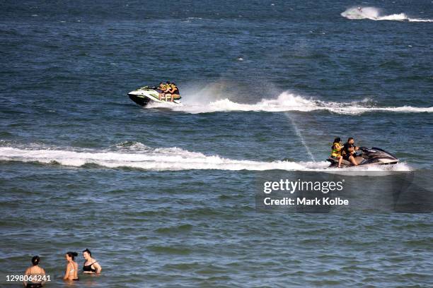 People ride jet skis on Botany Bay near the Kyeemagh Beach Baths on January 24, 2021 in Sydney, Australia. The Bureau of Meteorology has forecast...