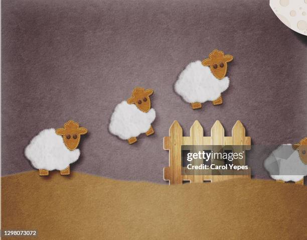 sheeps jumping a fence at night/ counting sheep concept - cotton cloud stock pictures, royalty-free photos & images