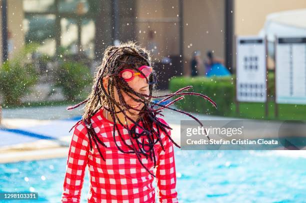 young girl with dreadlocks near swimming pool - girl wet casual clothing stock pictures, royalty-free photos & images