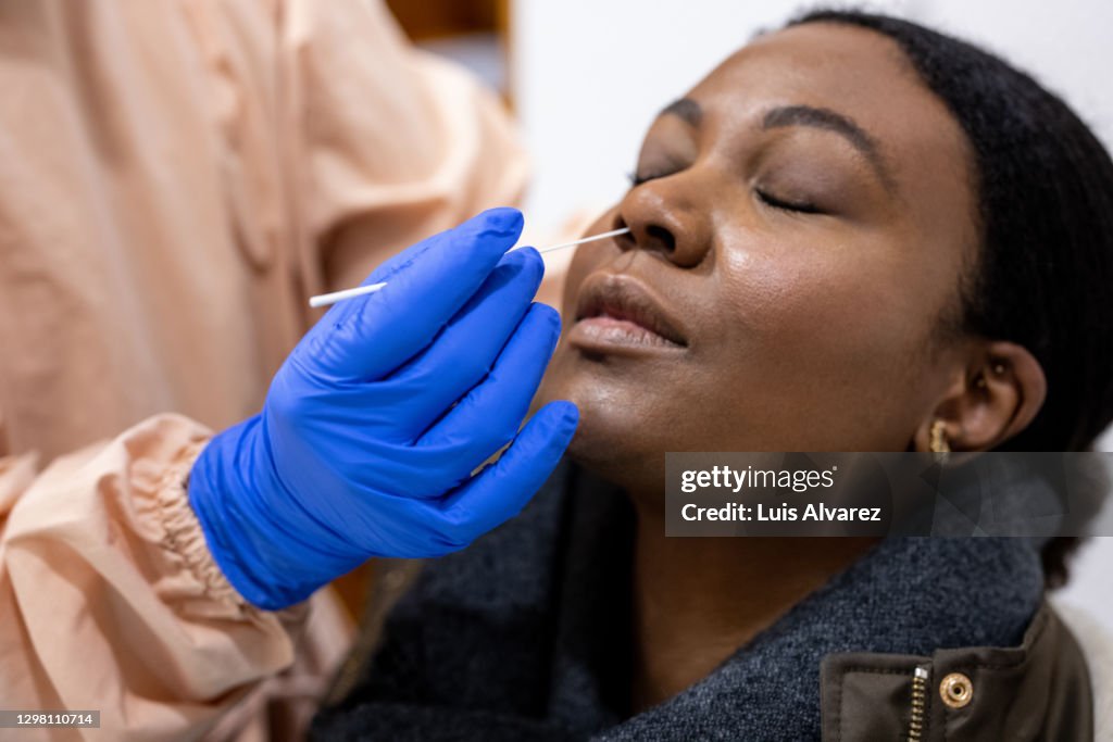 Young woman undergoing a coronavirus antigen test
