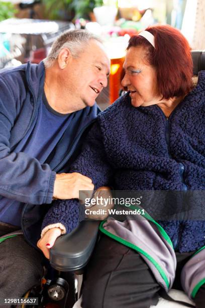 disabled heterosexual couple sitting at rehabilitation center - promises rehab center bildbanksfoton och bilder