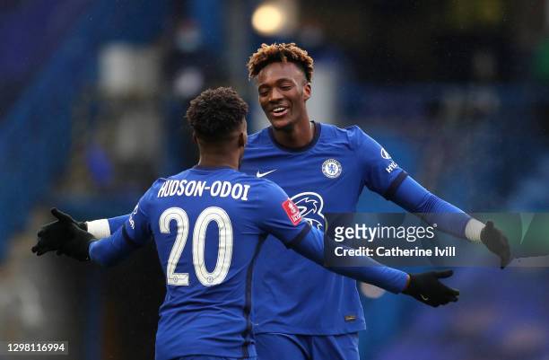 Tammy Abraham of Chelsea celebrates with team mate Callum Hudson-Odoi after scoring their side's third goal for their hat trick during The Emirates...