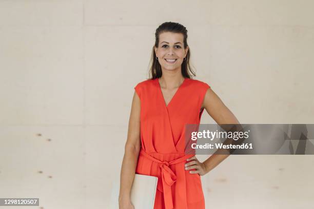 studio portrait of smiling businesswoman - sleeveless stock pictures, royalty-free photos & images