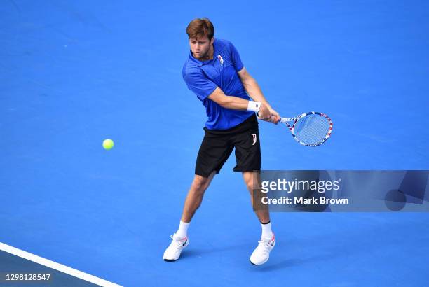 Ryan Harrison in action against Ariel Behar of Uruguay and Gonzalo Escobar of Ecuador while playing with his brother Christian Harrison during the...
