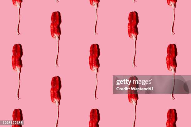 pattern of used tampons against pink background - tampon menstruation stock-fotos und bilder