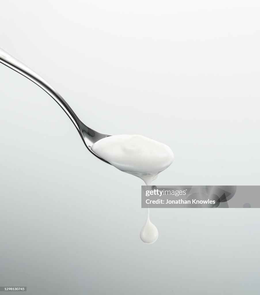 Yogurt dripping off spoon