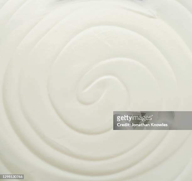 white swirling yogurt - milk swirl stock pictures, royalty-free photos & images