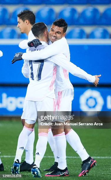 Carlos Casemiro of Real Madrid celebrates with his teammate Lucas Vazquez of Real Madrid after scoring the opening goal during the La Liga Santander...