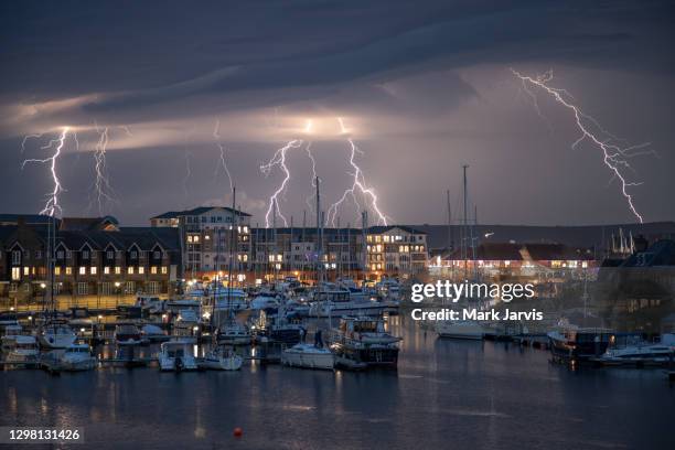 lightning over sovereign harbour eastbourne - thunderstorm uk stock pictures, royalty-free photos & images