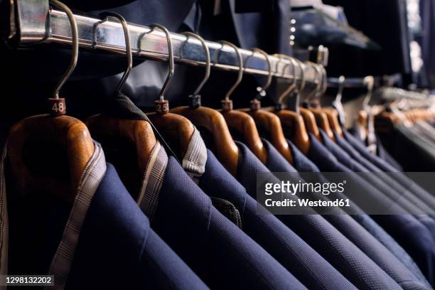 row of blazers on rack in tailors boutique - blazer jacket bildbanksfoton och bilder