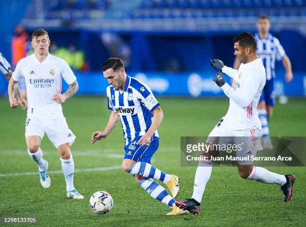 Carlos Casemiro of Real Madrid duels for the ball with Lucas Perez of Deportivo Alaves during the La Liga Santander match between Deportivo Alavés...