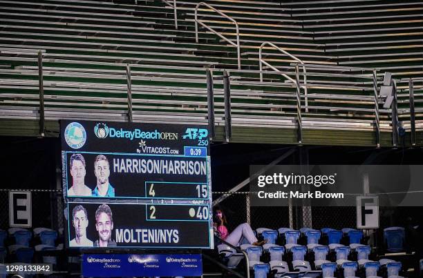 Fan watches the match between Christian and his brother Ryan Harrison against Hugo Nys of Monaco and Andrés Molteni of Argentina in the Doubles...