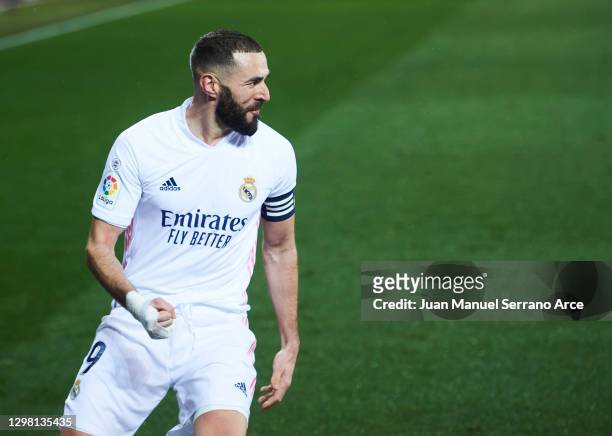 Karim Benzema of Real Madrid celebrates after scoring his team's second goal during the La Liga Santander match between Deportivo Alavés and Real...