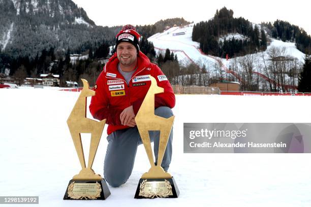 Beat Feuz of Switzerland poses with his two "Golden Chamois" winners trophy for winning both Audi FIS Alpine Ski World Cup Men's Downhill Hahnenkamm...