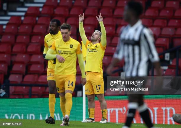 Scott Robinson of Livingston FC celebrates after scoring their side's first goal during the Betfred Cup Semi-Final match between Livingston and St...