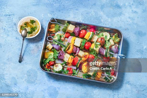 roasted vegan skewers in a baking tray - baked vegetables stock pictures, royalty-free photos & images
