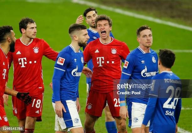Thomas Muller of FC Bayern Munich celebrates after scoring their side's third goal during the Bundesliga match between FC Schalke 04 and FC Bayern...