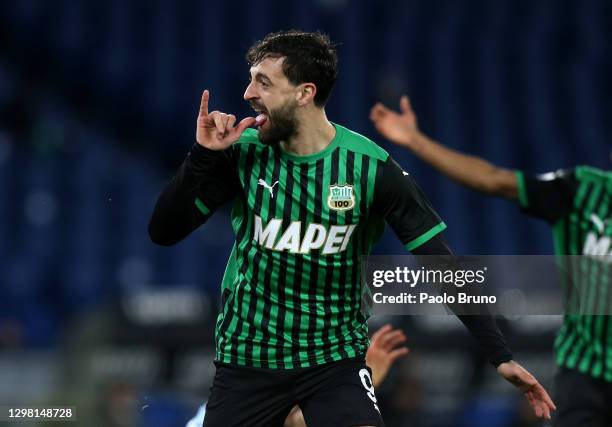 Kaan Ayhan of US Sassuolo celebrates after scoring their sides first goal during the Serie A match between SS Lazio and US Sassuolo at Stadio...