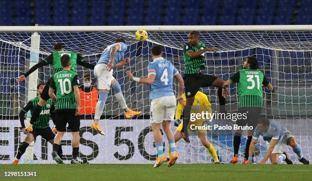 Sergej Milinkovic-Savic of Lazio scores their sides first goal pasy Andrea Consigli of US Sassuolo during the Serie A match between SS Lazio and US...