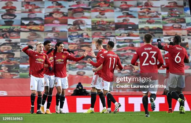 Marcus Rashford of Manchester United celebrates with Donny Van De Beek, Edinson Cavani and team mates after scoring their side's second goal during...