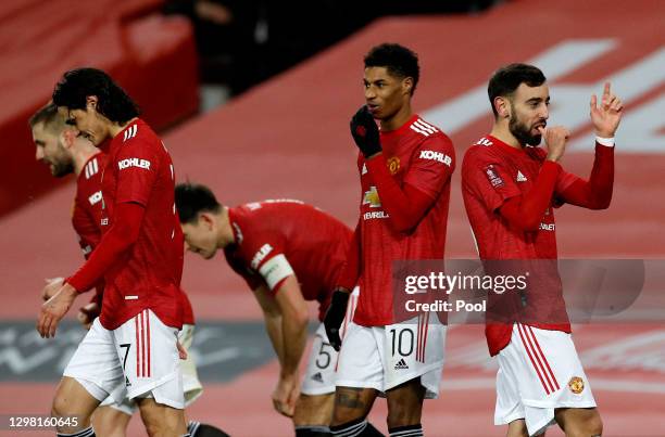 Bruno Fernandes of Manchester United celebrates with Edinson Cavani, Marcus Rashford and team mates after scoring their side's third goal during The...