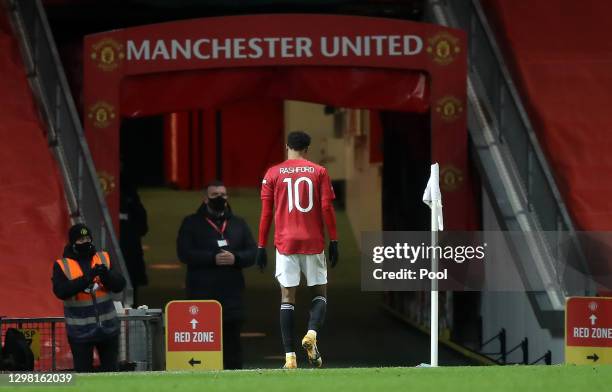 Marcus Rashford of Manchester United leaves the field after appearing to pick up an injury during The Emirates FA Cup Fourth Round match between...