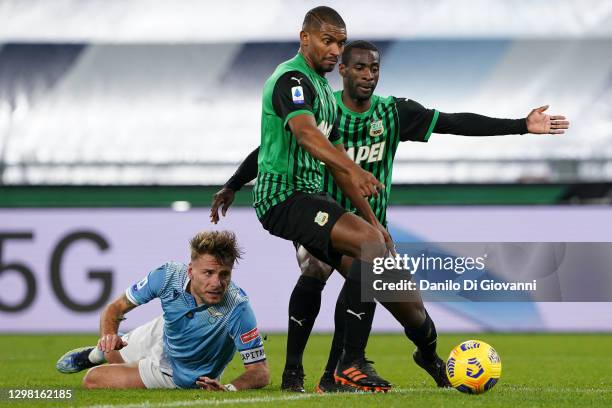 Ciro Immobile of S.S. Lazio fight with Marlon of US Sassuolo and Pedro Obiang of US Sassuolo during the Serie A match between SS Lazio and US...