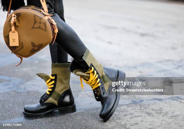 Black and olive green boots with yellow laces by Louis Vuitton as a News  Photo - Getty Images