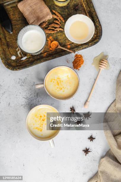 tumeric golden milk chai latte kurkuma tea with milk - kurkuma stock pictures, royalty-free photos & images