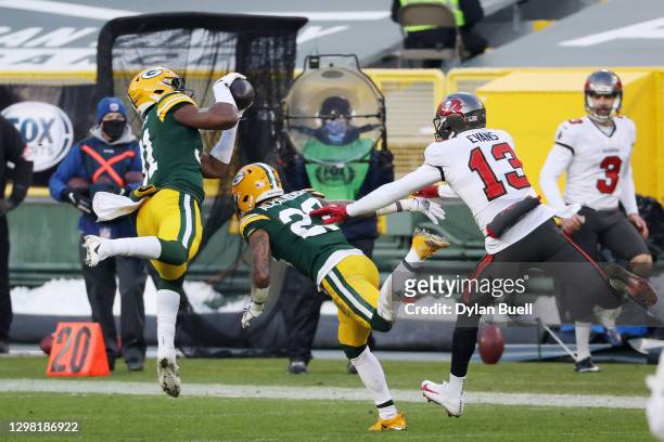 Adrian Amos of the Green Bay Packers intercepts a pass intended for Mike Evans of the Tampa Bay Buccaneers in the third quarter during the NFC...