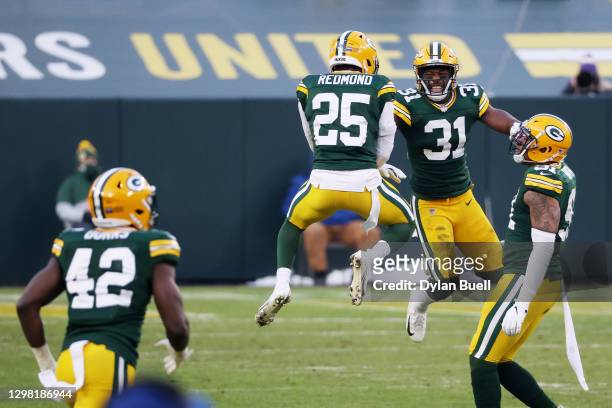 Adrian Amos of the Green Bay Packers celebrates after intercepting a pass intended for Mike Evans of the Tampa Bay Buccaneers in the third quarter...
