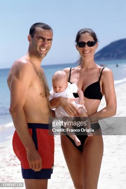 Former Italian football player Giuseppe Bergomi poses with his wife Daniela, and daughter Sara at Forte Village Resort on July, 1999 in Santa...