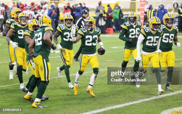 Jaire Alexander of the Green Bay Packers celebrates his interception in the fourth quarter against the Tampa Bay Buccaneers during the NFC...