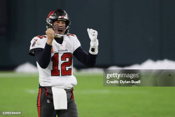 Tom Brady of the Tampa Bay Buccaneers celebrates in the final seconds of their 31 to 26 win over the Green Bay Packers during the NFC Championship...