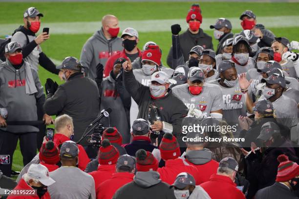 Head coach Bruce Arians of the Tampa Bay Buccaneers celebrates with his team team after their 31 to 26 win over the Green Bay Packers during the NFC...