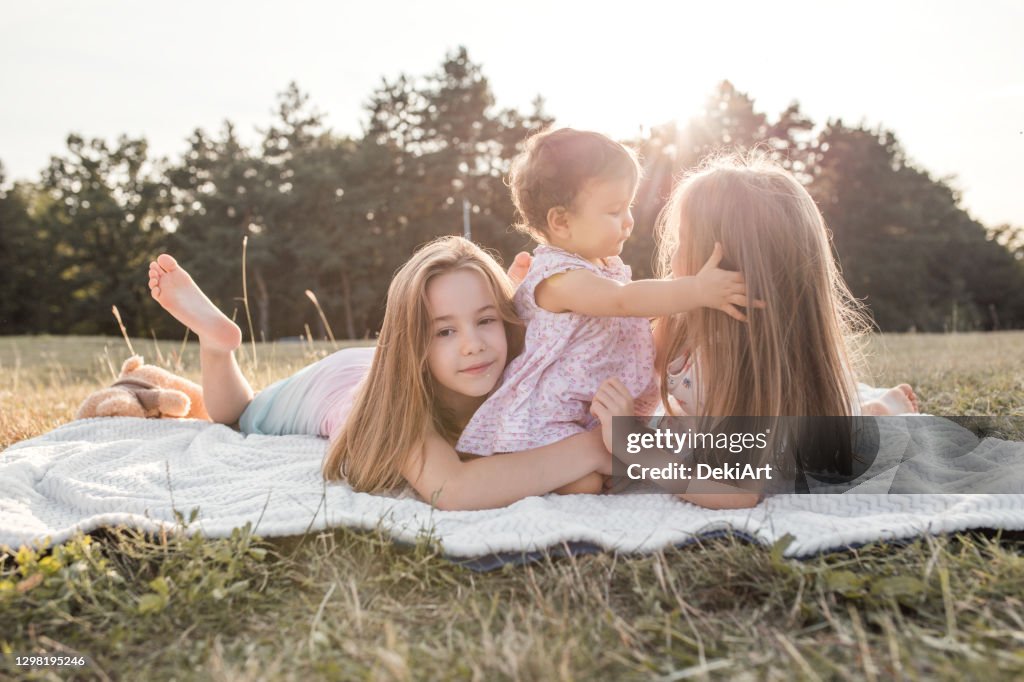 Three Fun Three Sisters Having Fun On A Picnic High-Res Stock Photo - Getty Images