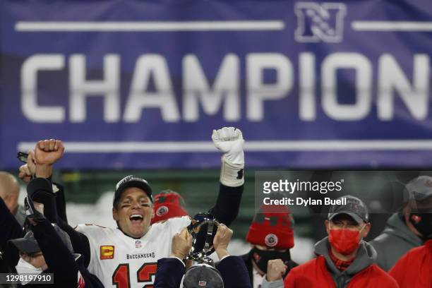 Tom Brady of the Tampa Bay Buccaneers celebrates with teammates after their 31 to 26 win over the Green Bay Packers during the NFC Championship game...