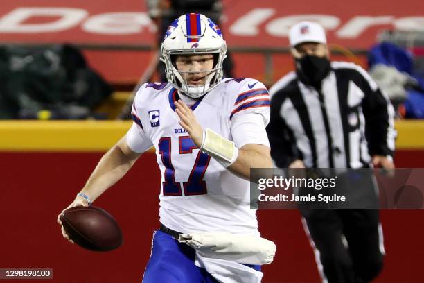 Josh Allen of the Buffalo Bills runs with the ball in the first quarter against the Kansas City Chiefs during the AFC Championship game at Arrowhead...