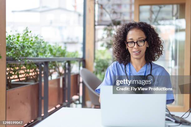 nurse meeting with patient virtually using video call health technology - nurse education stock pictures, royalty-free photos & images