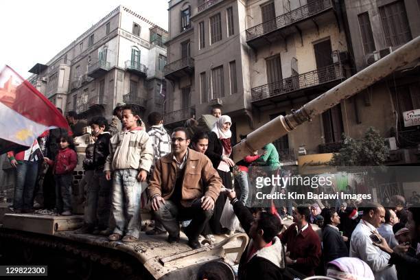 Egyptians celebrate the revolution in Tahrir Square by posing for photos with Army tanks on February 13, 2011 in downtown Cairo, Egypt.