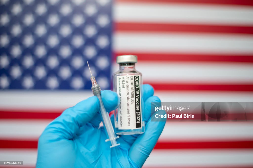 Covid-19 vaccine with syringe and American flag image in the background, Coronavirus SARS-CoV-2, vaccination