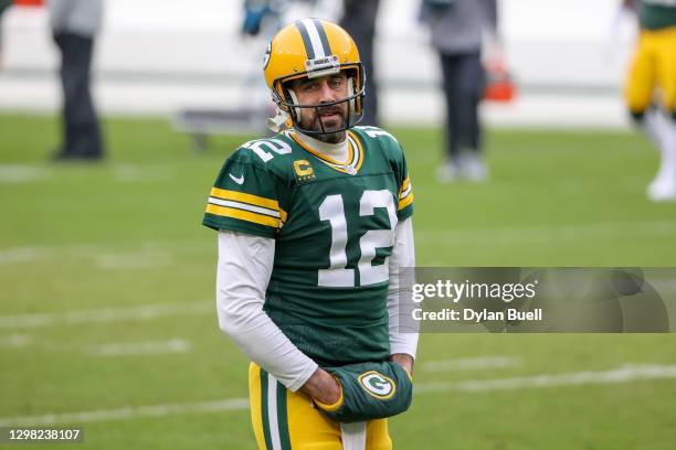 Aaron Rodgers of the Green Bay Packers warms up before the NFC Championship game against the Tampa Bay Buccaneers at Lambeau Field on January 24,...