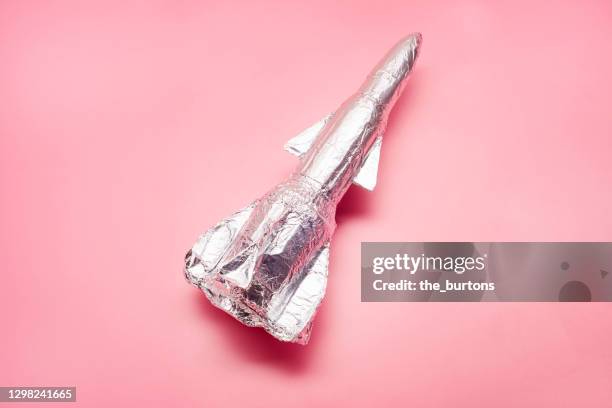 still life of a self made rocket on pink background - launch party inside stock pictures, royalty-free photos & images