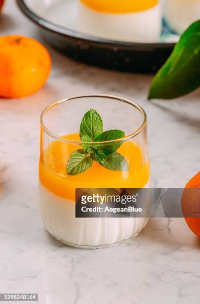 panna cotta with orange jelly - panna cotta stock pictures, royalty-free photos & images